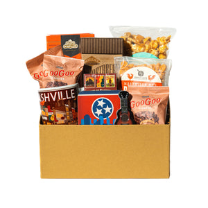 collection of snacks mug, coaster, mints and playing cards in a gift box.