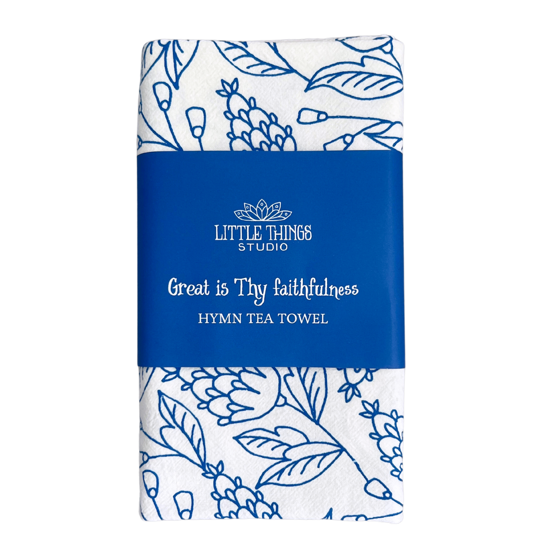 Chorus from hymn "Great is Thy Faithfulness" on white cotton towel with bright blue floral pattern. 