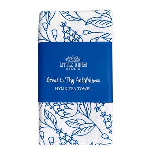 Chorus from hymn "Great is Thy Faithfulness" on white cotton towel with bright blue floral pattern. 
