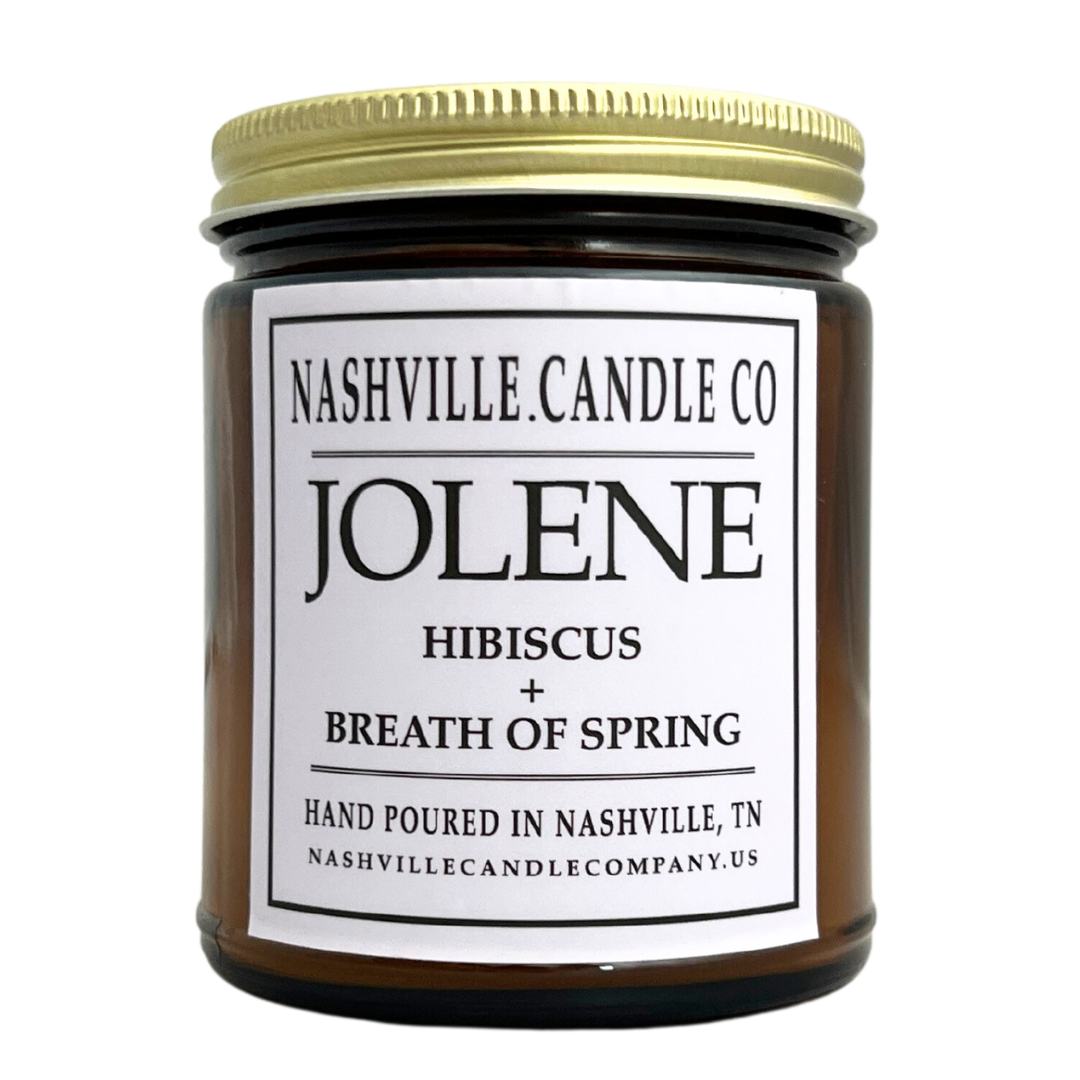 "Jolene" candle scented with hibiscus, amber glass jar with lid. 