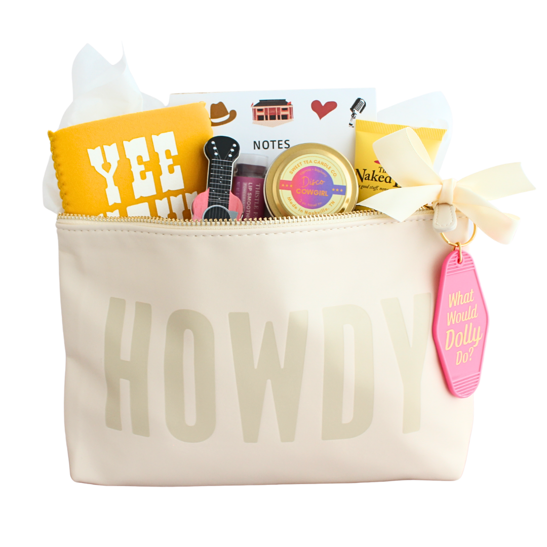 collection of lotion, candle, mints lip balm, coozie, keychain and notepad in a zipper pouch. 