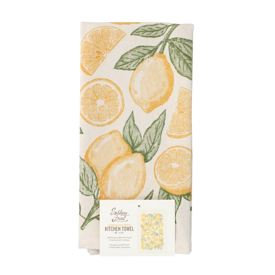 lemons screen printed on cotton kitchen towel in yellow and green.