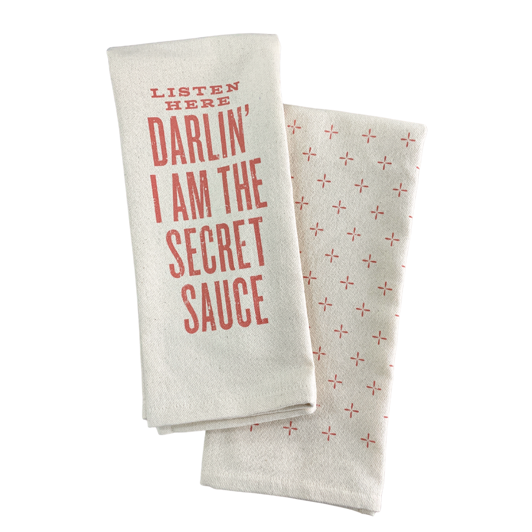 screen printed on cotton kitchen towel in pink "I am the secret sauce"