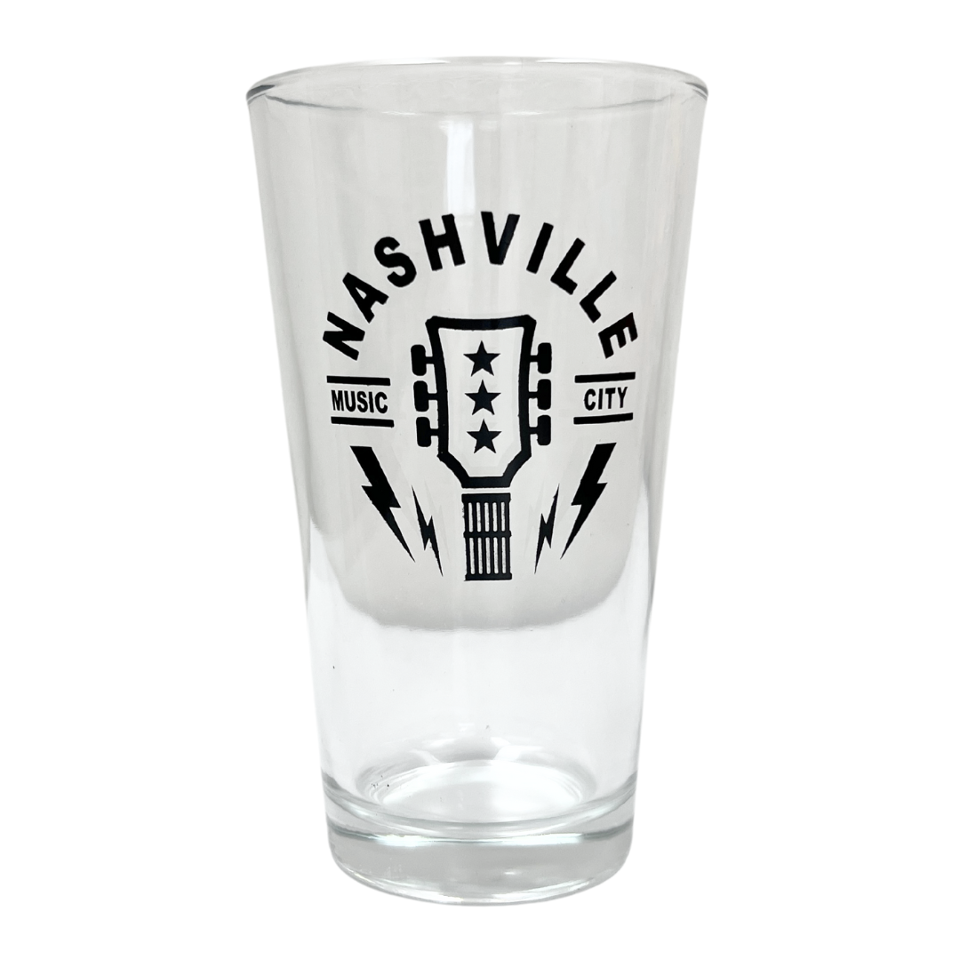pint glass with guitar headstock, says Nashville Music City. 