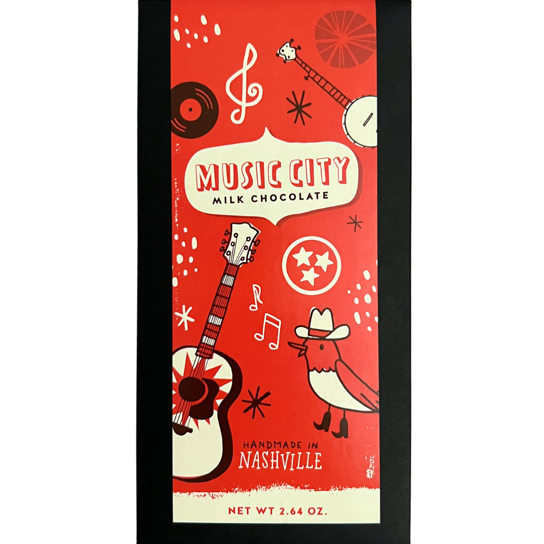 bar of milk chocolate in black wrapper with red label with Music City symbols.