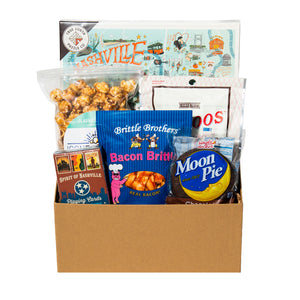 collection of snacks, playing cards and a puzzle. 