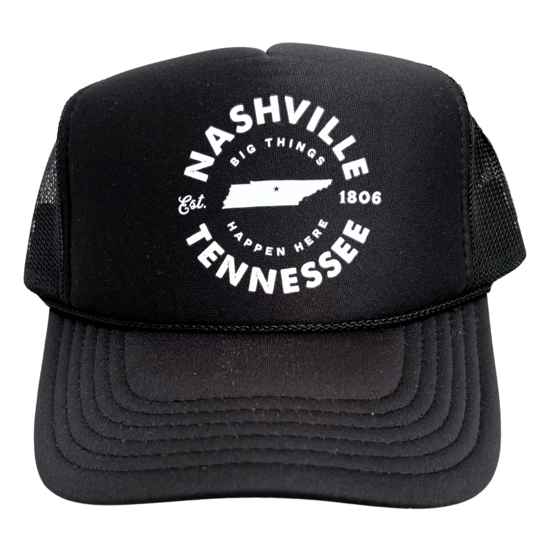Black trucker hat with foamy front and mesh sides says, "Nashville Tennessee Big Things Happen Here" in white.