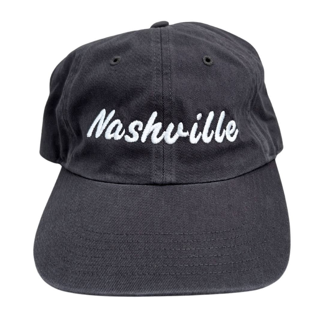Grey ball cap hat with "Nashville" embroidered in white. 