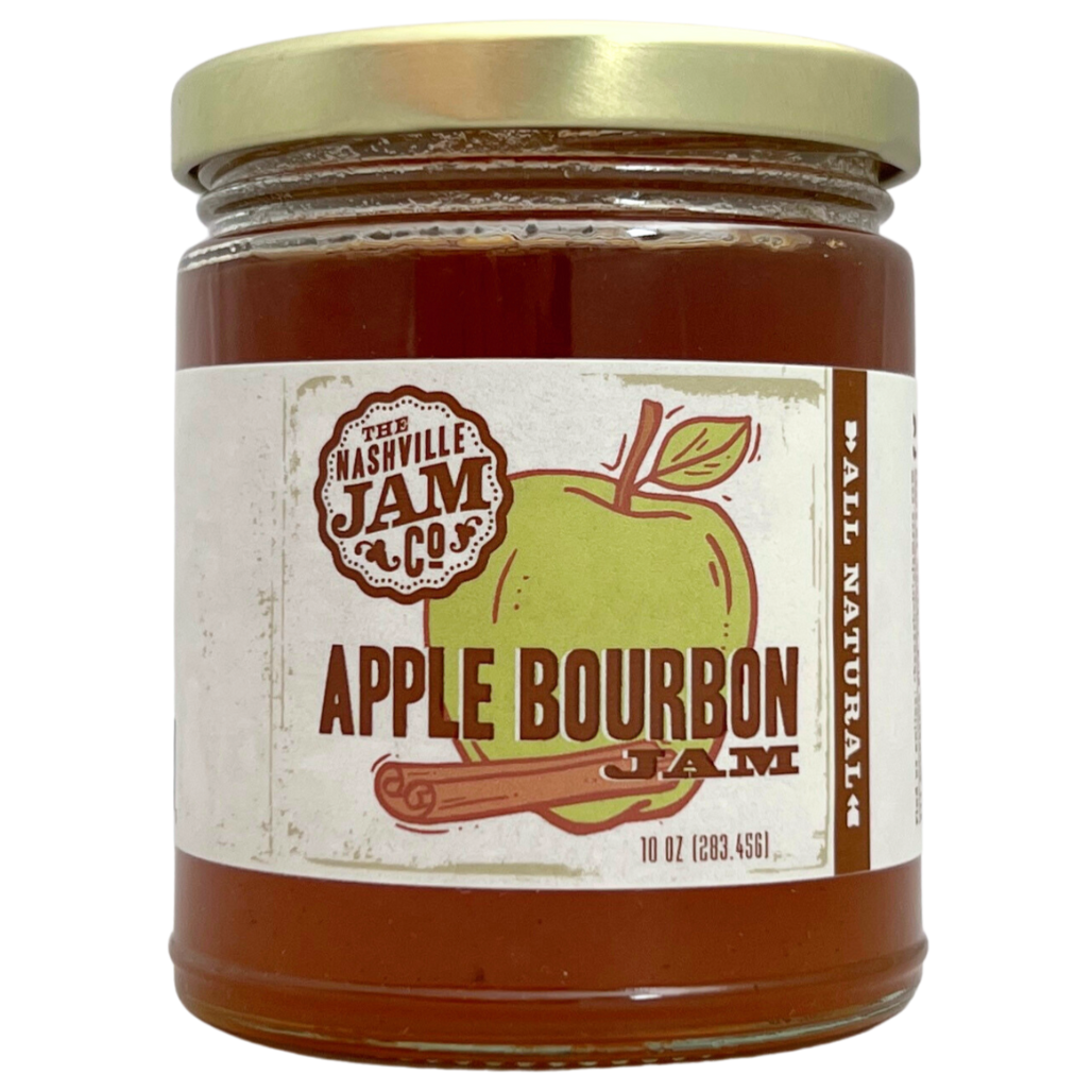 Apple Bourbon jam in 10 oz clear glass jar with gold lid, label has illustration of a apple and cinnamon. 
