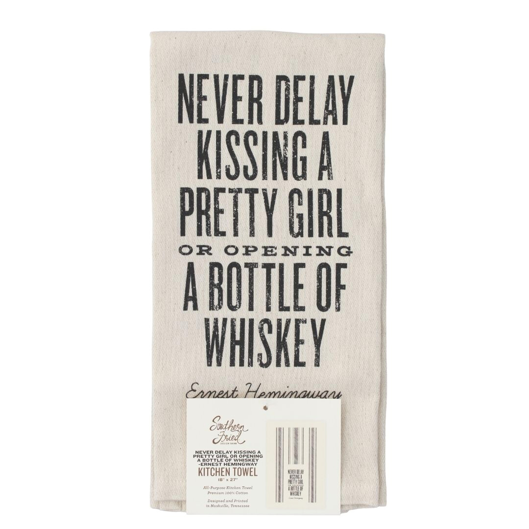 screen printed on cotton kitchen towel in black, "Never Delay Kissing a Pretty Girl or Opening a Bottle of Whiskey"