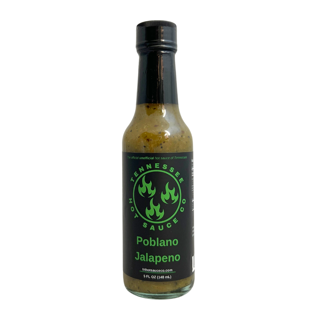 Poblano Jalapeno sauce in a glass bottle. Black label with black cap.