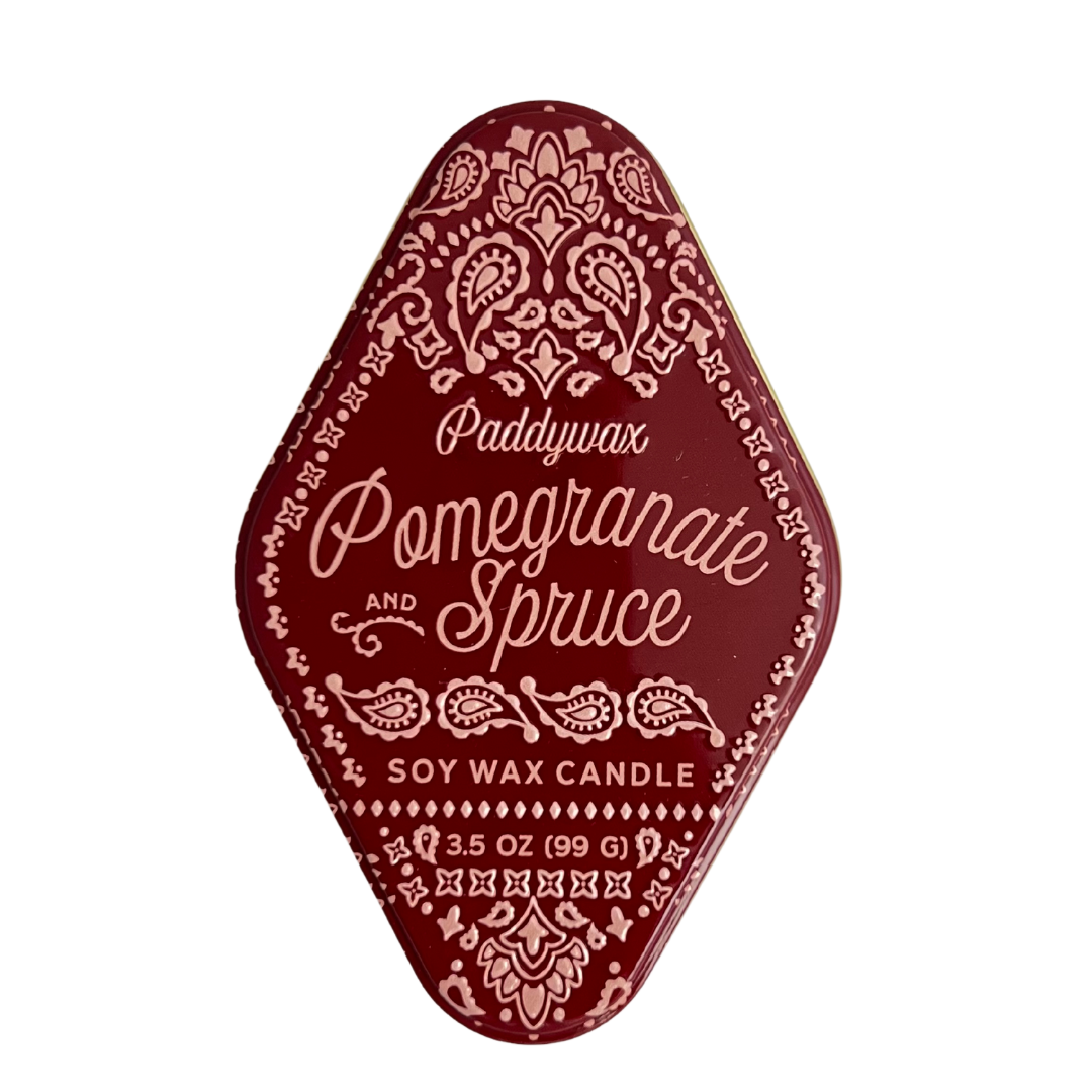 3.5 oz soy wax candle scented pomegranate and spruce.