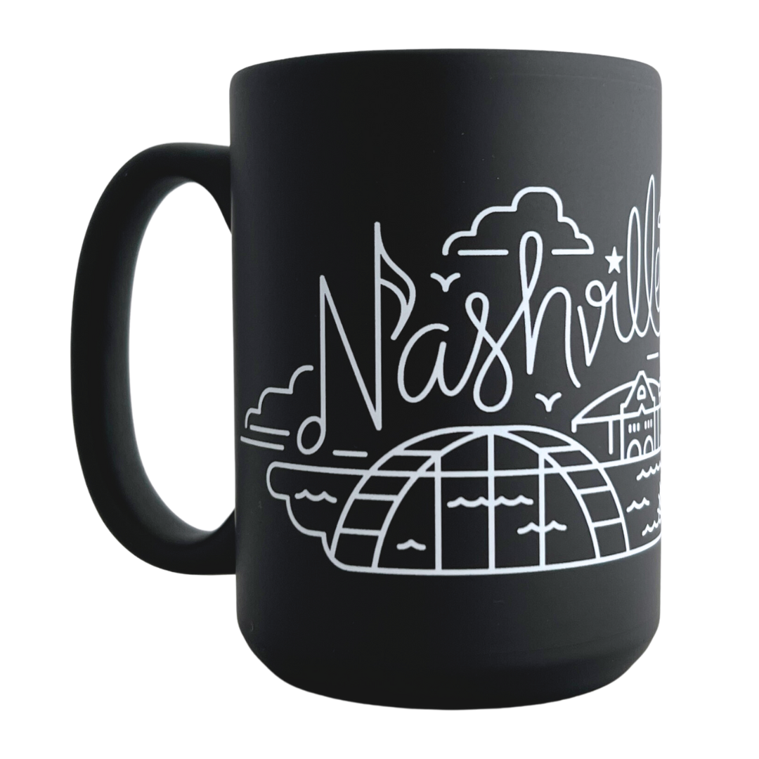 Matte black mug with Nashville skyline mug in white swirling outline.