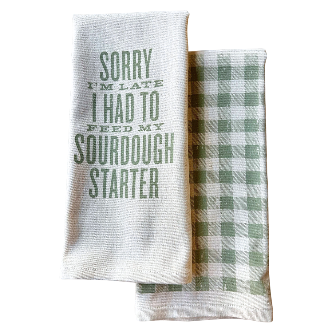 funny saying screen printed on cotton kitchen towel in green.