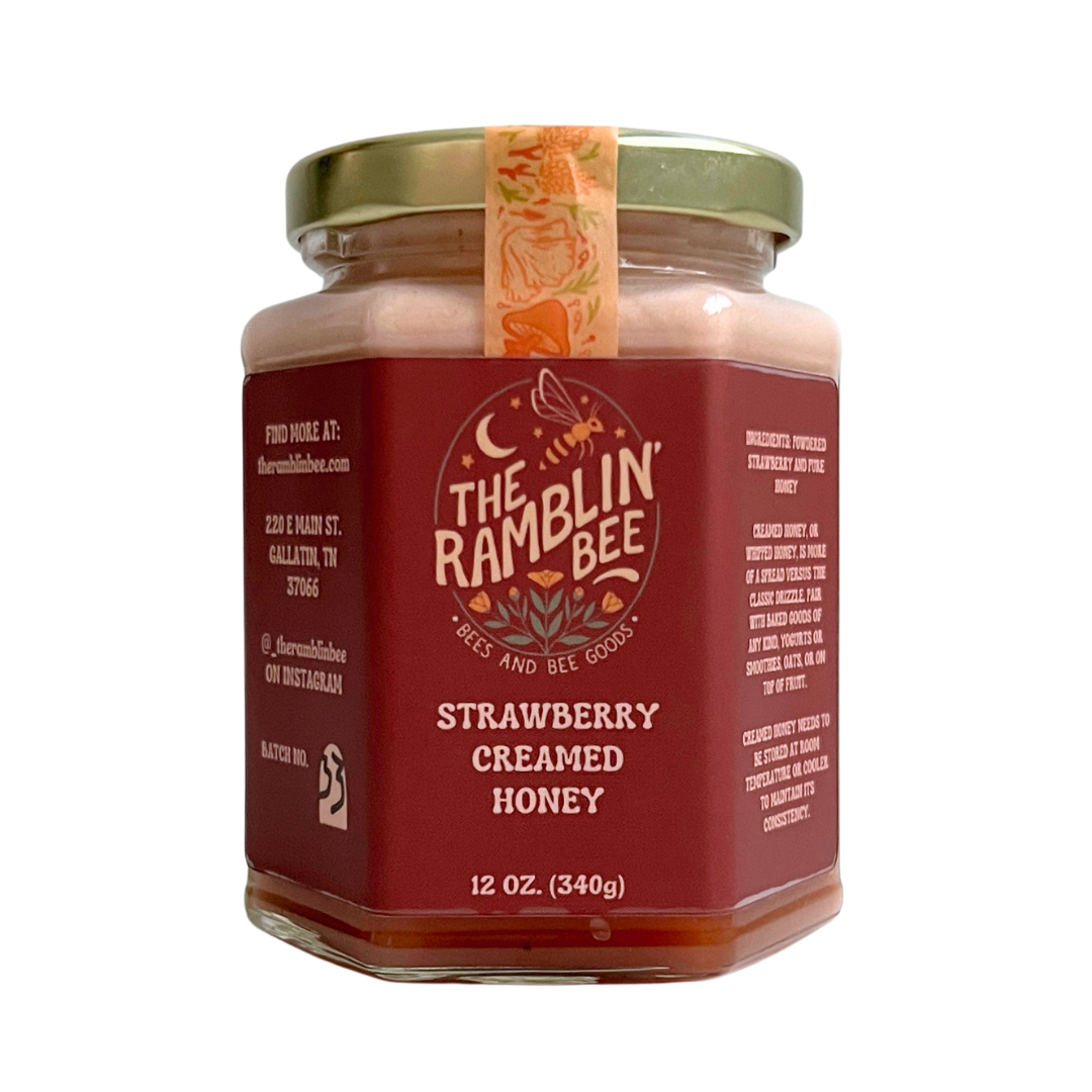 12 oz glass jar of the ramblin' bee strawberry creamed honey. Gold lid for extra sealage.