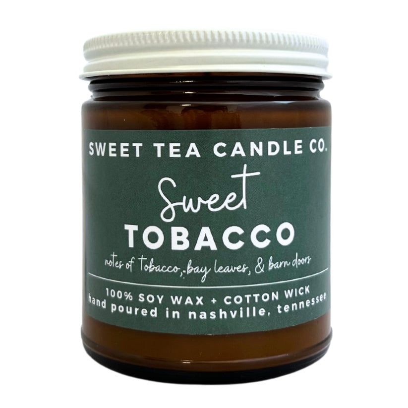 "Sweet Tobacco" candle from Sweet Tea Candle Company. Notes of tobacco, bay leaves, and barn doors. 100% soy wax candles + cotton wick. Hand poured in Nashville, Tennessee.
