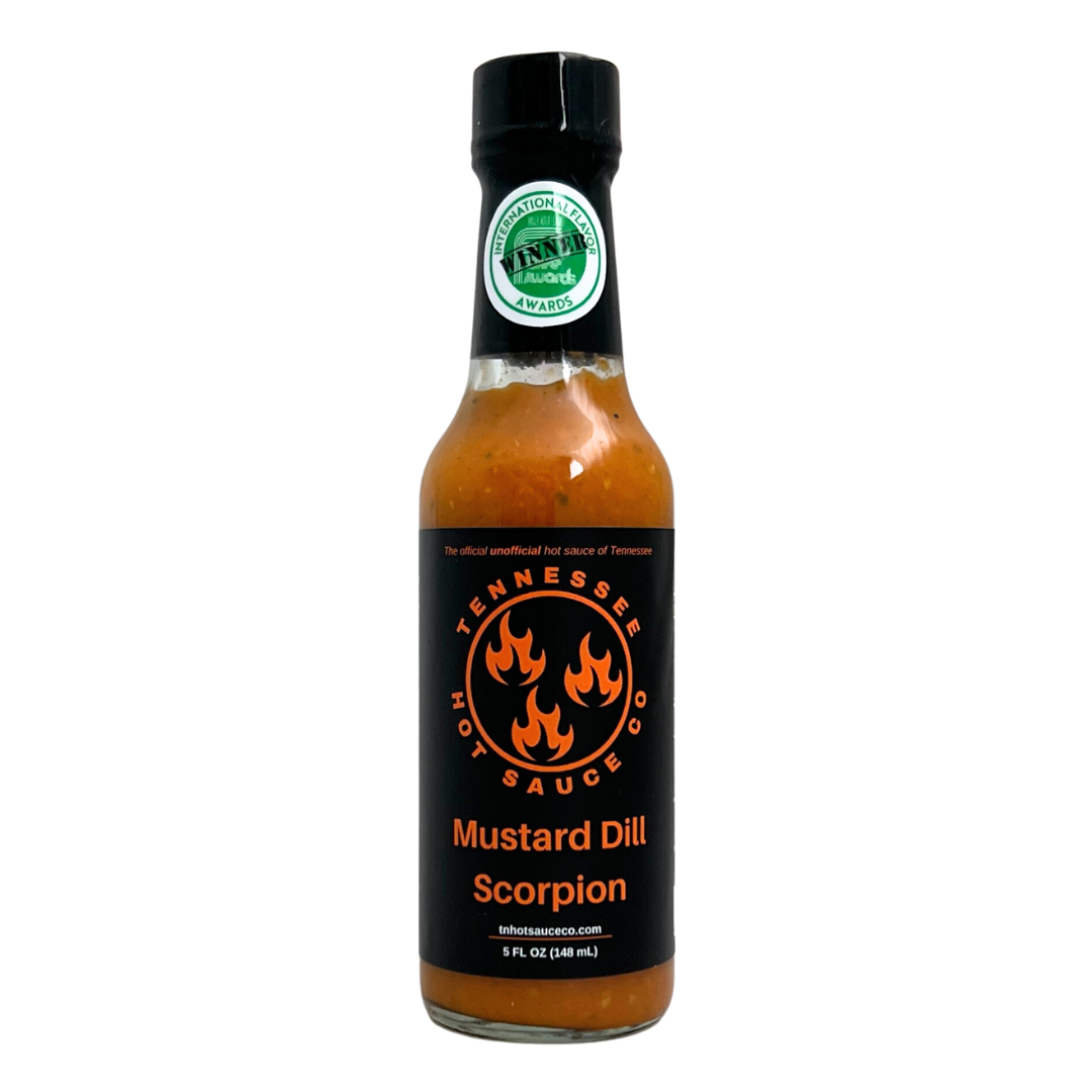 Mustard Dill Scorpion sauce in a glass bottle. Black cap.