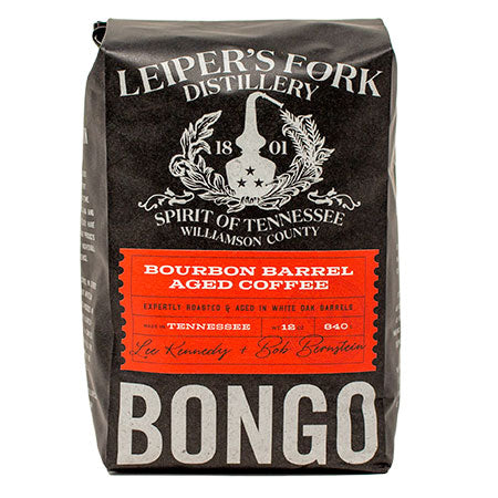 Whole coffee beans aged in Leiper's Fork Distillery barrels. 