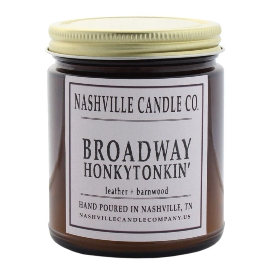 Broadway Honkytonkin' candle from Nashville Candle Company will have you putting on your boot and hat. Scents of leather and barnwood. Hand-poured in Nashville, Tennessee. 9 oz candle.