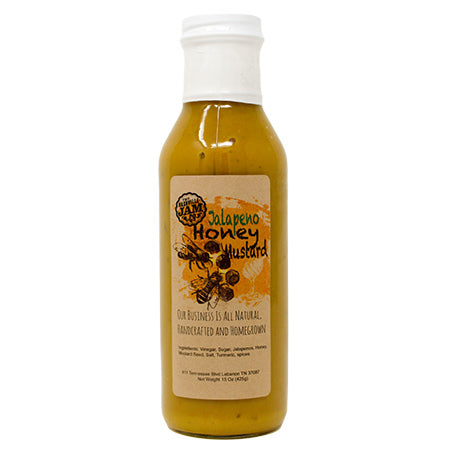15 oz clear glass bottle of jalapeno honey mustard.