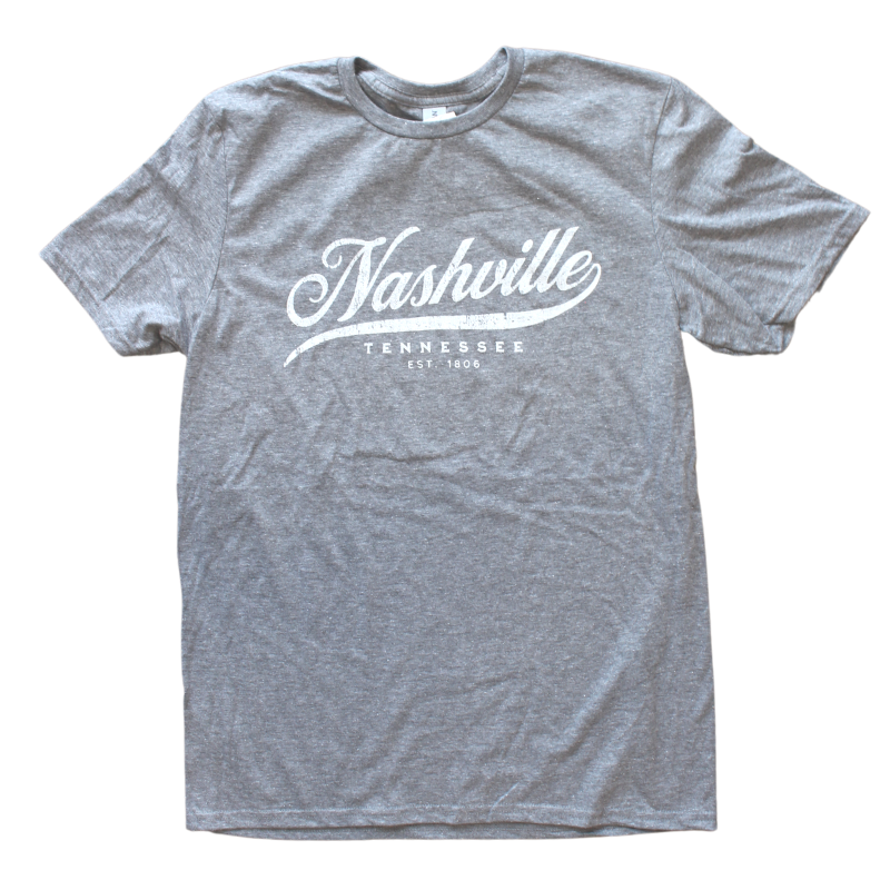 Gray shirt says, "Nashville, Tennessee" screen-printed in white. 