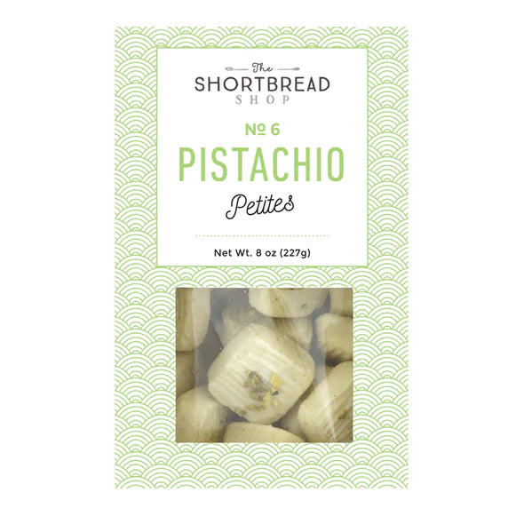 Mini pistachio shortbread bites in a 8 oz shell colored box. Has a little clear window to see the product. Company logo is featured.