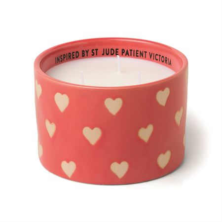 11 oz candle in red reusable glazed ceramic vessel with hearts.