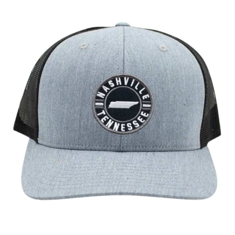 light gray trucker style hat with black mesh sides round patch on front says nashville tennessee, with state in the middle